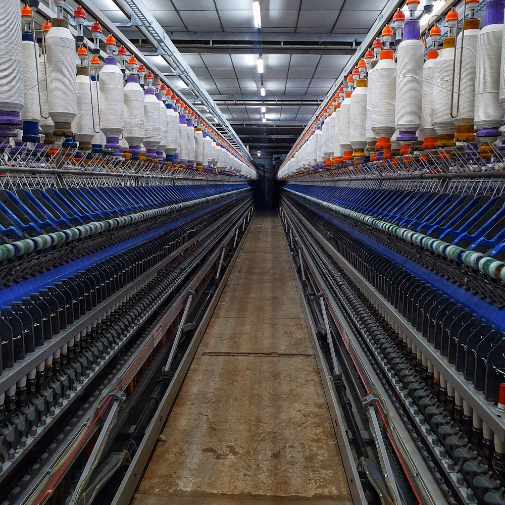 Textile mill with rows of yarn bobbins