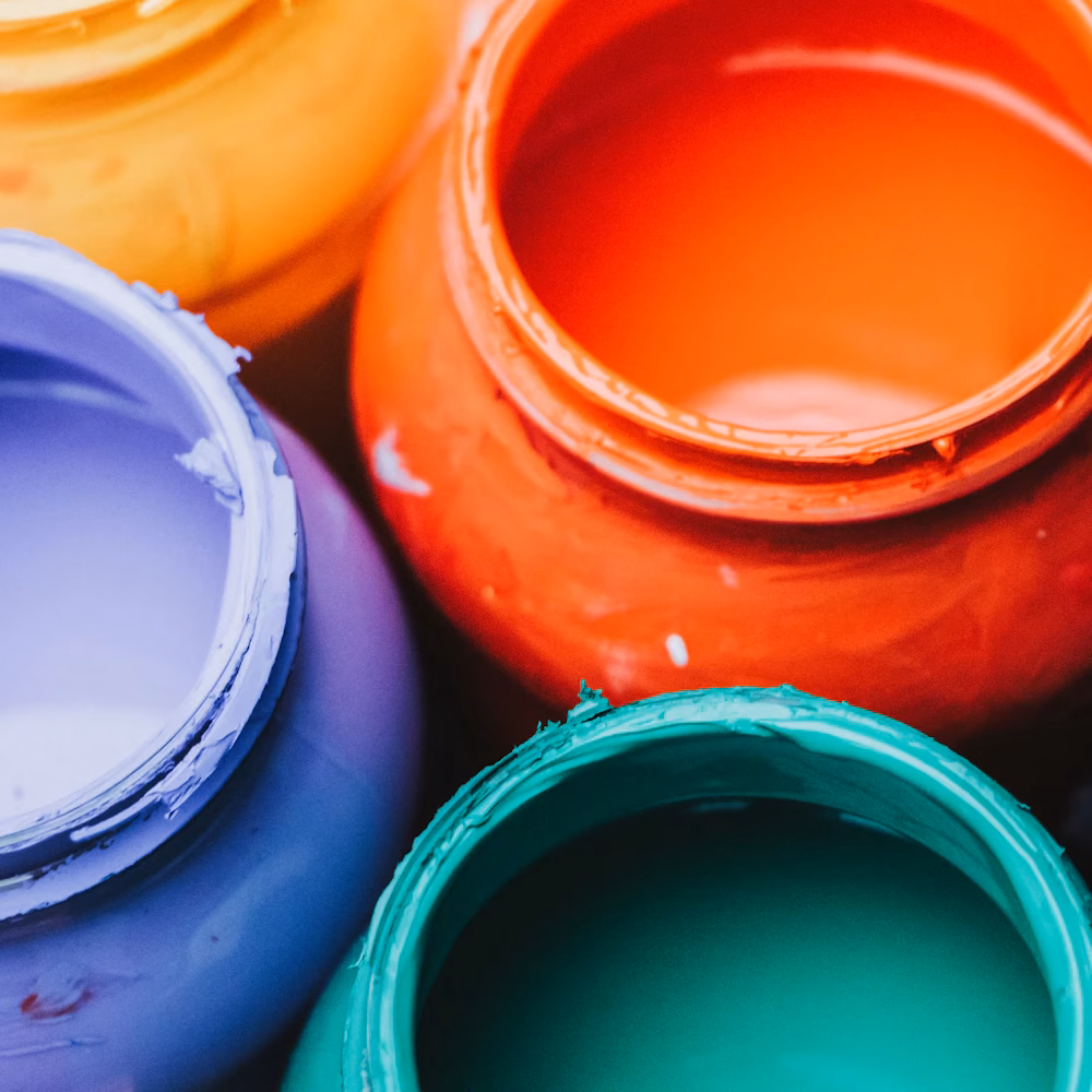 Open paint tins with colour
